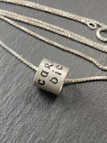 Carpe Diem in celtic font is hand stamped on sterling silver ring charm pendant.  seize the day latin phrase ring charm necklace. drake designs jewelry