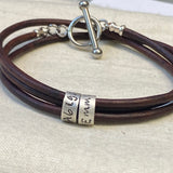 leather bracelet with personalized sterling silver charms with kids names and toggle clasp - triple wrapped leather- drake designs jewelry 