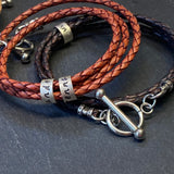 personalized braided leather bracelet for men or women with toggle clasp and personalized sterling silver name charms
