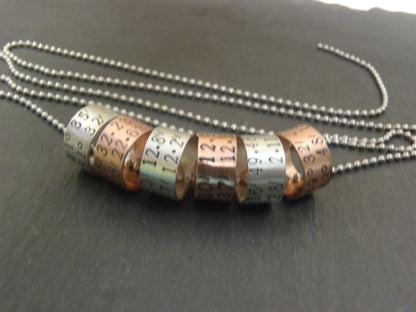 sterling silver or copper charms are personalized with latitude longitude coordinates - Drake Designs Jewelry