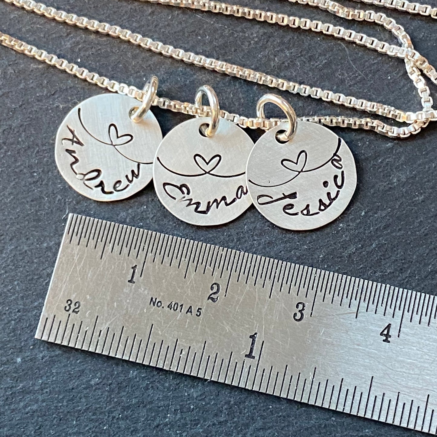 linked by love sterling silver mom necklace with kids names and heart links hand stamped. small charm necklace with childrens names linked together by love.  drake designs jewelry