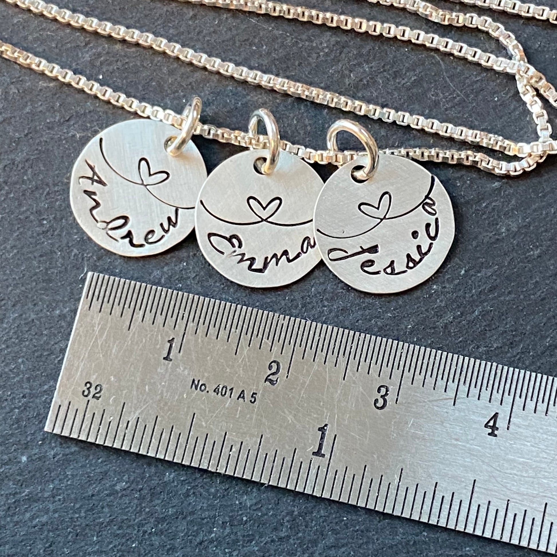 linked by love sterling silver mom necklace with kids names and heart links hand stamped. small charm necklace with childrens names linked together by love.  drake designs jewelry