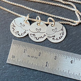 sterling silver mom necklace with kids names and heart links hand stamped. small charm necklace with childrens names linked together by love.  drake designs jewelry