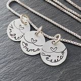 mom necklace with kids names linked by love.  sterling silver hand stamped charms with hearts.  drake designs jewelry