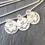 sterling silver mom necklace with kids names and hearts hand stamped.  love knot necklace. drake designs jewelry  Edit alt text