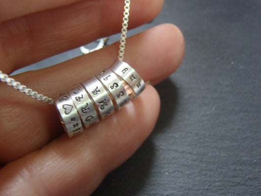 tiny hand stamped name charms on  Sterling silver mothers necklace personalized with kids names - Drake Designs Jewelry