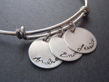 Mother's bracelet with children's name charms in script font on an adjustable bangle bracelet - Drake Designs Jewelry